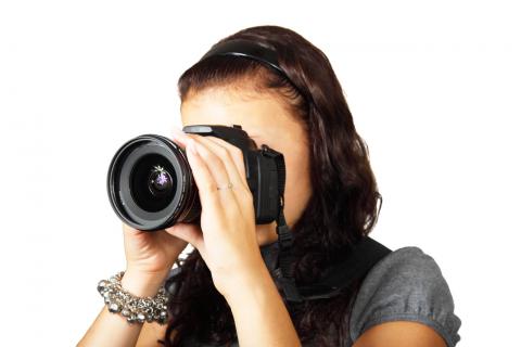 Real Estate Photographer taking still images with DSLR camera